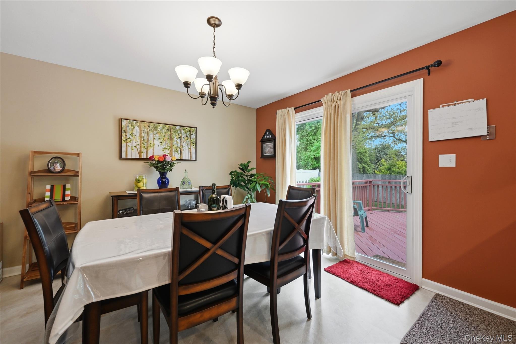 41 Lane Street Lindenhurst, NY 11757 - Photo 16 of 35 Formal or informal dining area with sliders to the deck