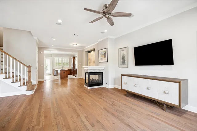 a large kitchen with a large window and stainless steel appliances