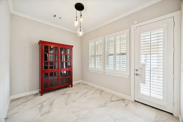 a view of a livingroom with furniture flat screen tv and wooden floor