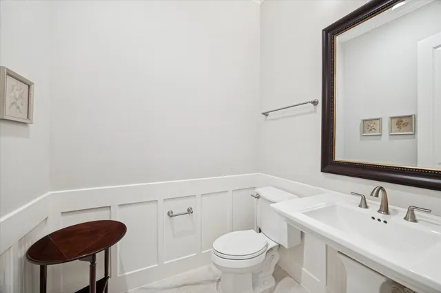 a view of storage and utility room with wooden floor