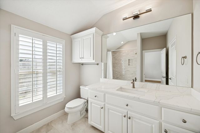 a view of a house with pool and chairs