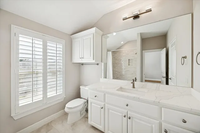 a view of a house with pool and chairs