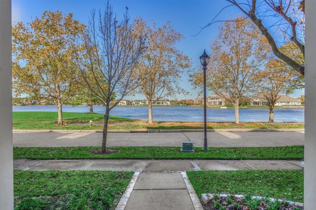 a view of a livingroom with a flesh screen and stairs