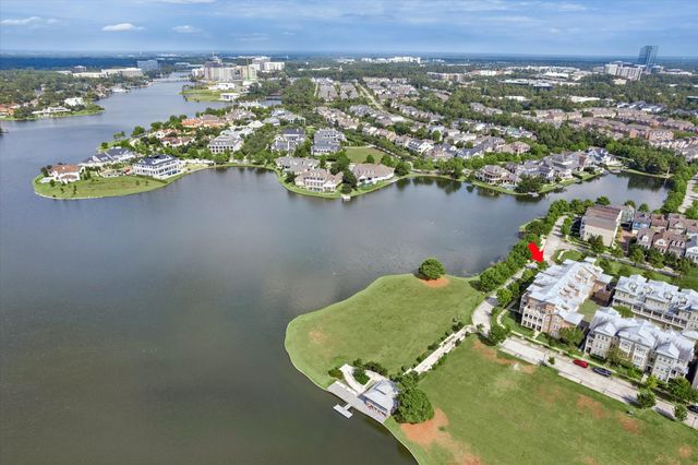 a view of a hallway with wooden floor and entryway