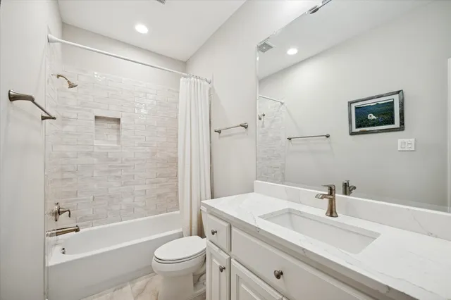 a kitchen that has a cabinets a sink and a refrigerator