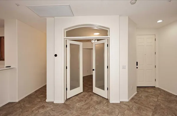 a view of a hallway with closet area
