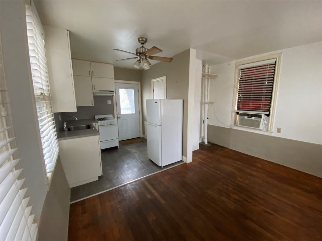 300 West 37th Street, Unit B Austin, TX 78705 - Photo 1 of 1 a view of a kitchen with a stove wooden floor and a kitchen