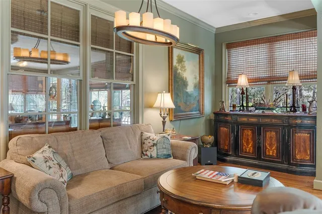 a living room with dining room and wooden floor