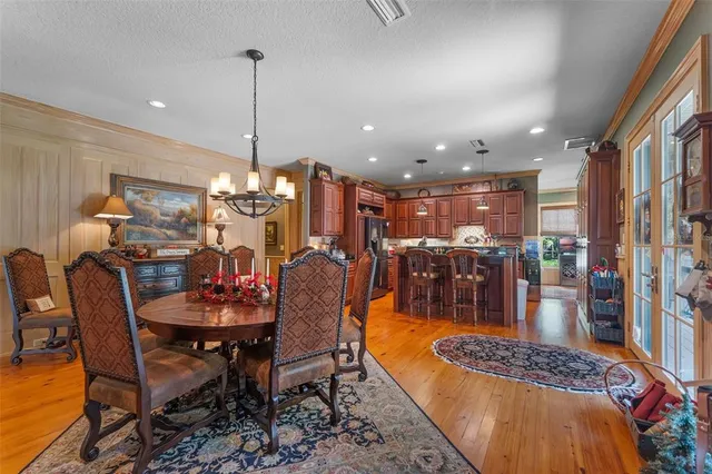 a kitchen with stainless steel appliances granite countertop a stove refrigerator and cabinets