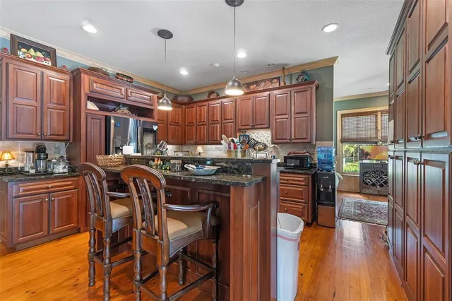 a living room with furniture and a lamp