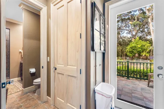 a view of a patio with wooden floor and outdoor seating