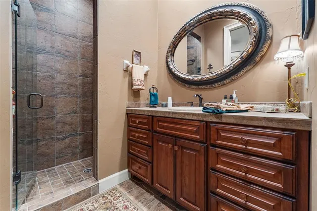 a view of a patio with table and chairs under an umbrella