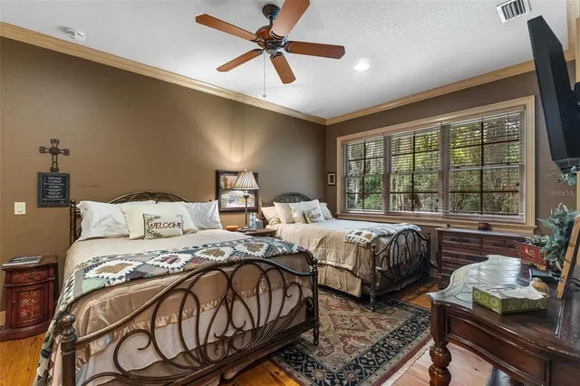 a front view of a house with garden and porch