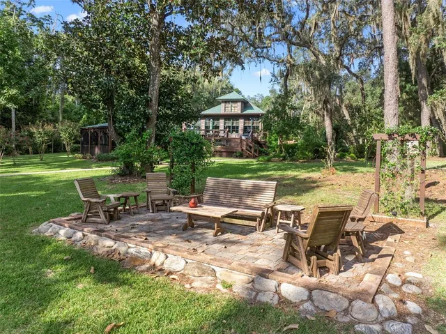 a view of a house with a yard and plants