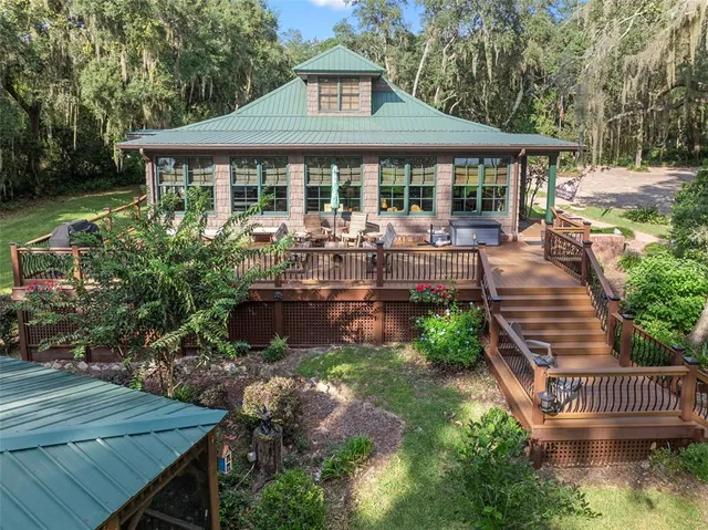 a view of outdoor space with wooden floor and windows