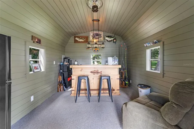 an aerial view of a houses with ocean view