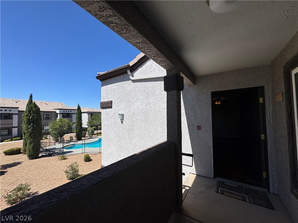 7255 West Sunset Road, Unit 2111 Las Vegas, NV 89113 - Photo 23 of 33 An inviting entry balcony offers serene pool views and neighborhood ambiance.