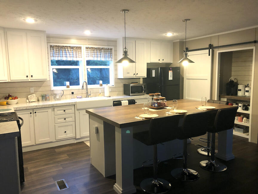 1485 Pine Ridge Road Huddleston, VA 24104 - Photo 11 of 52 a kitchen with a sink stove and cabinets