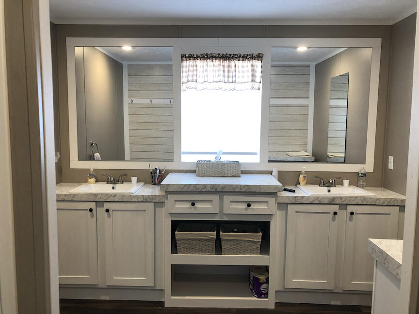 1485 Pine Ridge Road Huddleston, VA 24104 - Photo 16 of 52 a kitchen with stainless steel appliances granite countertop a sink and cabinets with wooden floor