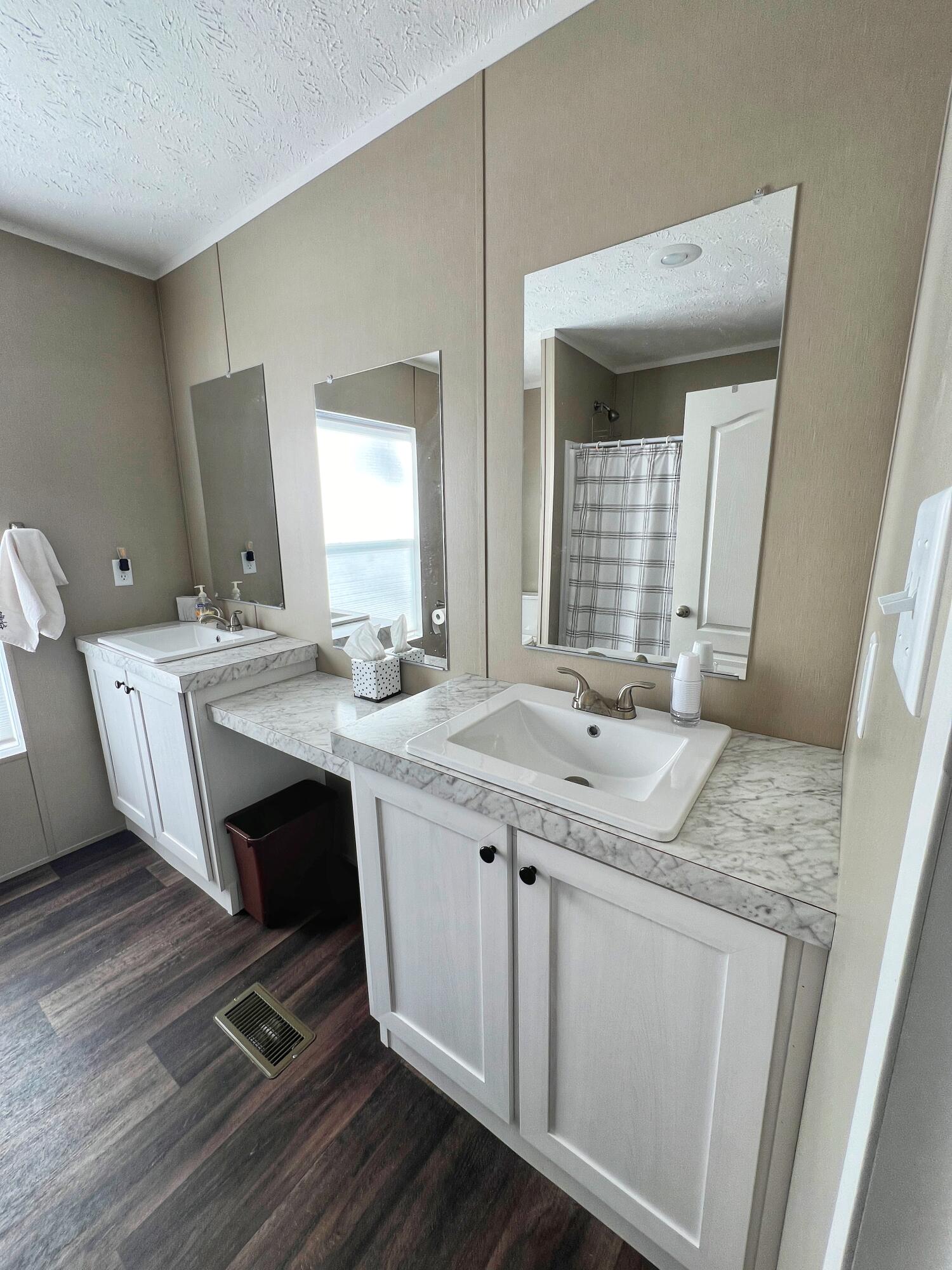 1485 Pine Ridge Road Huddleston, VA 24104 - Photo 17 of 52 a bathroom with a granite countertop sink a toilet and mirror