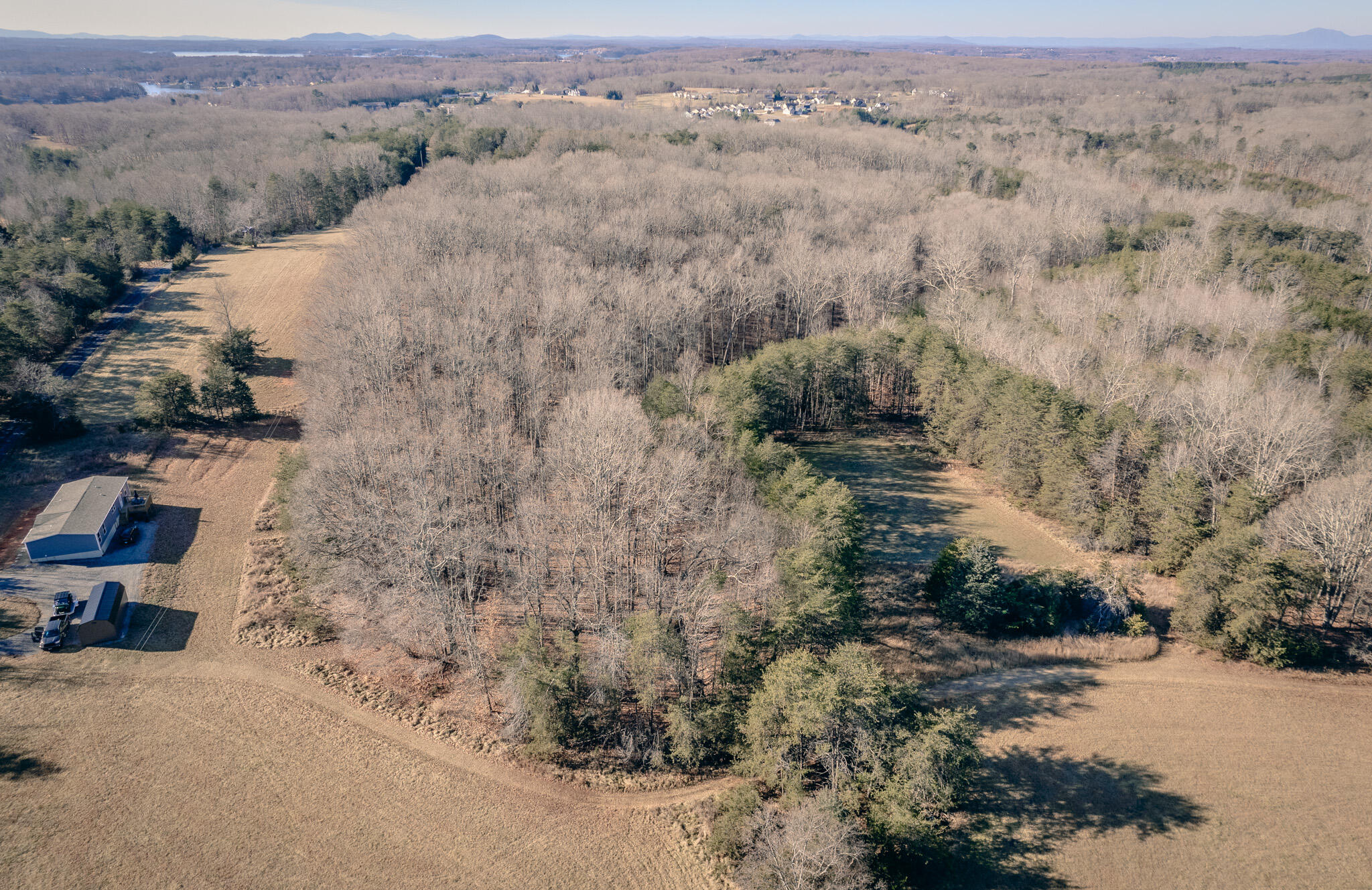 1485 Pine Ridge Road Huddleston, VA 24104 - Photo 3 of 52 an aerial view of house with yard and mountain view in back