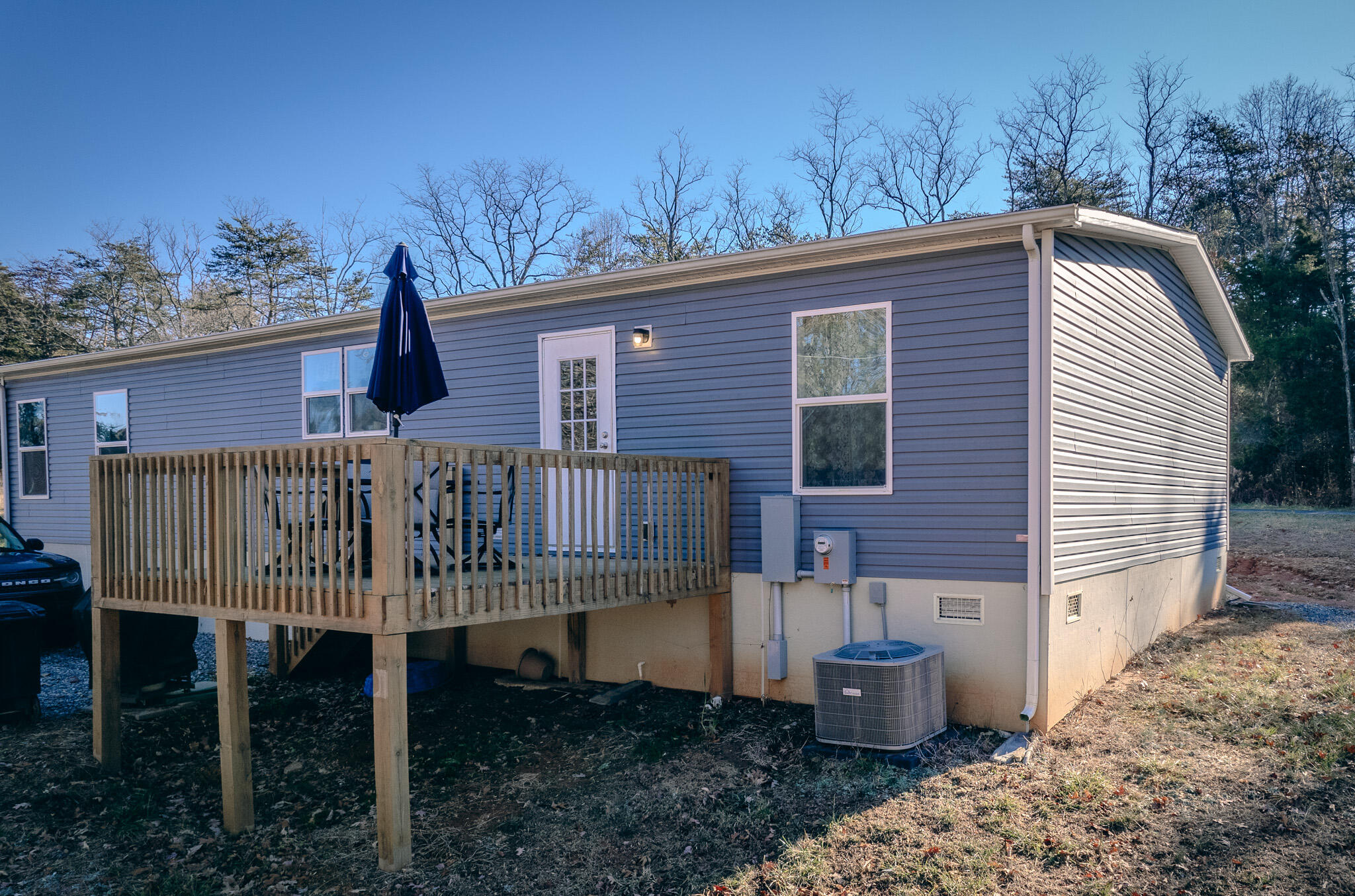 1485 Pine Ridge Road Huddleston, VA 24104 - Photo 8 of 52 a backyard of a house with table and chairs
