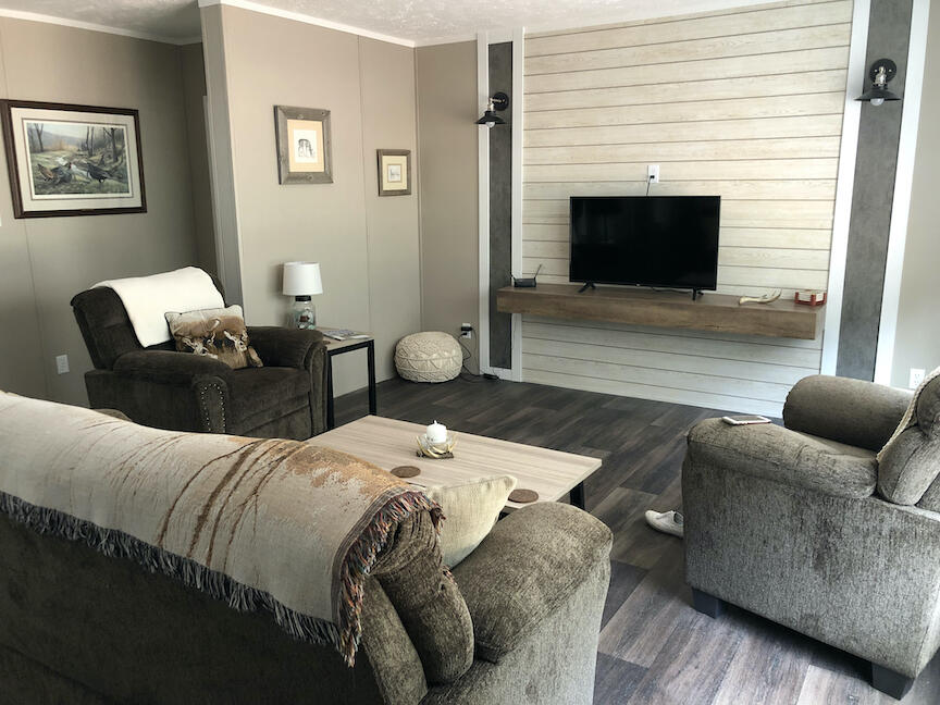 1485 Pine Ridge Road Huddleston, VA 24104 - Photo 9 of 52 a living room with furniture and a flat screen tv