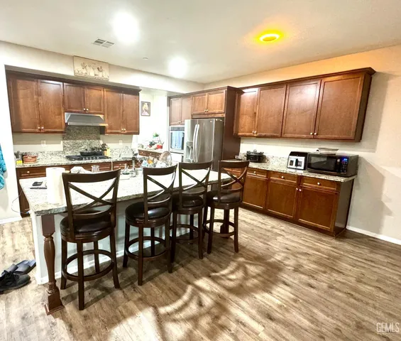 a kitchen with lots of counter space and appliances