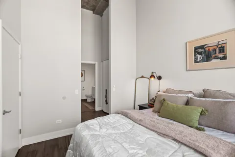 a bedroom with a bed and a couch