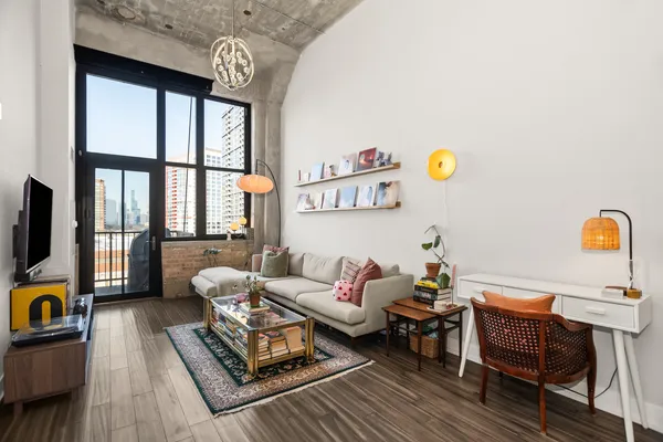 a living room with furniture and a window