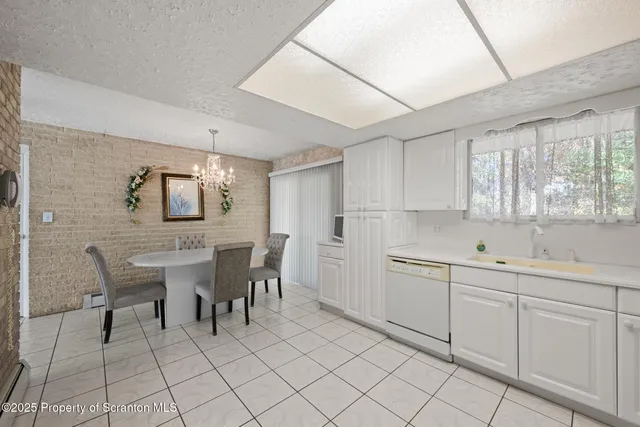 a bathroom with a sink a toilet and shower curtain