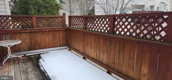 a wooden bench sitting in front of a wooden building