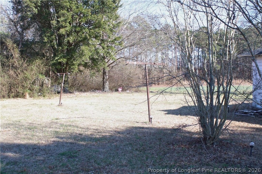 5029 Lovette Road Lumberton, NC 28358 - Photo 2 of 6 a view of a yard covered with snow in the yard