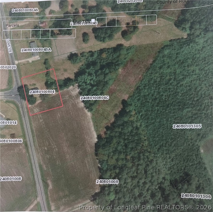 5029 Lovette Road Lumberton, NC 28358 - Photo 5 of 6 an aerial view of residential houses with outdoor space