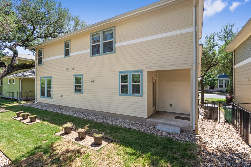 11229 Avery Station Loop, Unit 36 Austin, TX 78717 - Photo 37 of 37 Back of property with a fenced backyard and a patio area