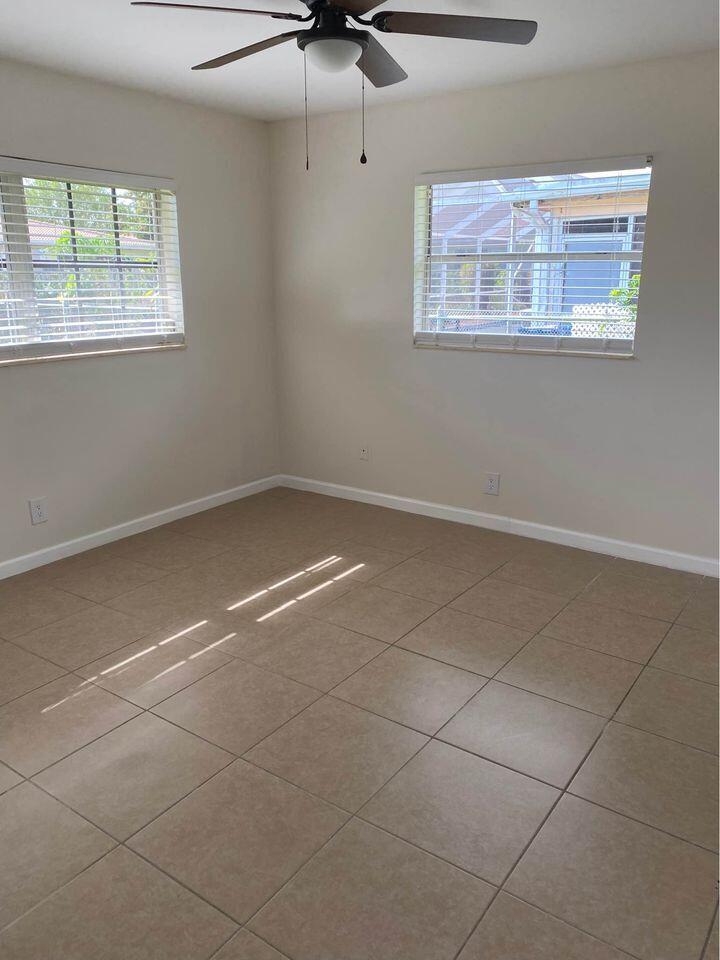 3952 Northwest 83rd Lane Coral Springs, FL 33065 - Photo 7 of 10 a view of an empty room with a window