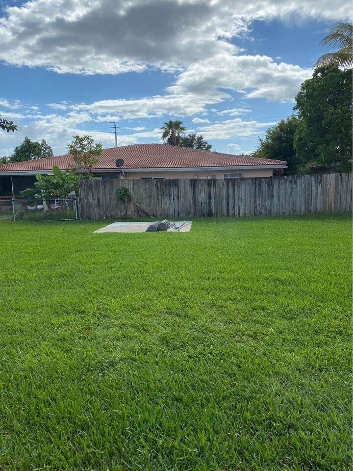 3952 Northwest 83rd Lane Coral Springs, FL 33065 - Photo 10 of 10 a view of a backyard with an ocean