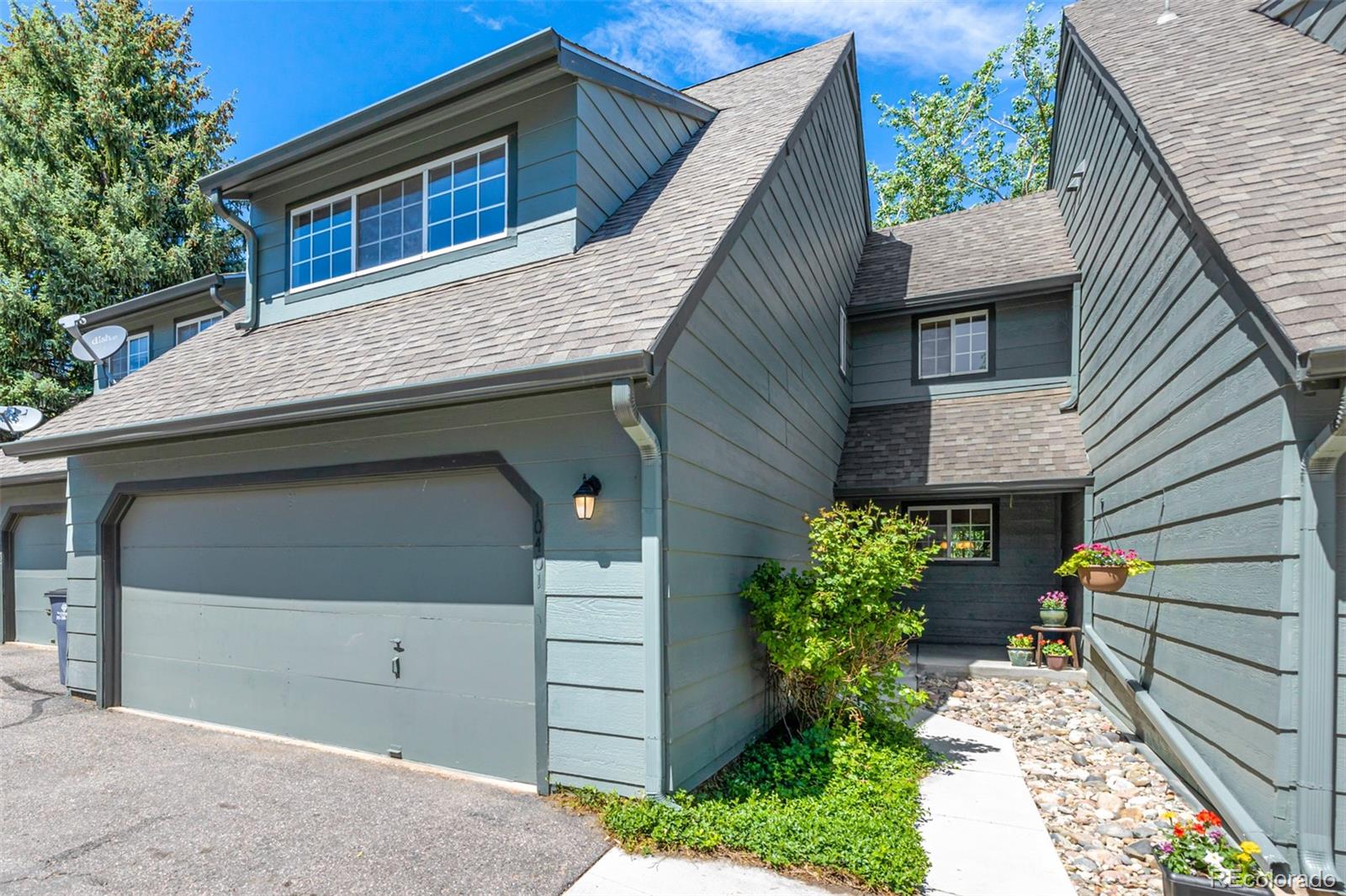 10401 West Red Mountain Road Littleton, CO 80127 - Photo 1 of 40 a house view with a outdoor space