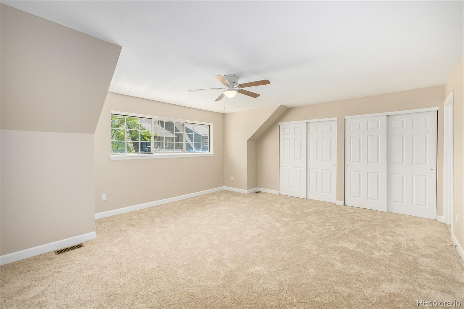 10401 West Red Mountain Road Littleton, CO 80127 - Photo 20 of 40 a view of an empty room with a window