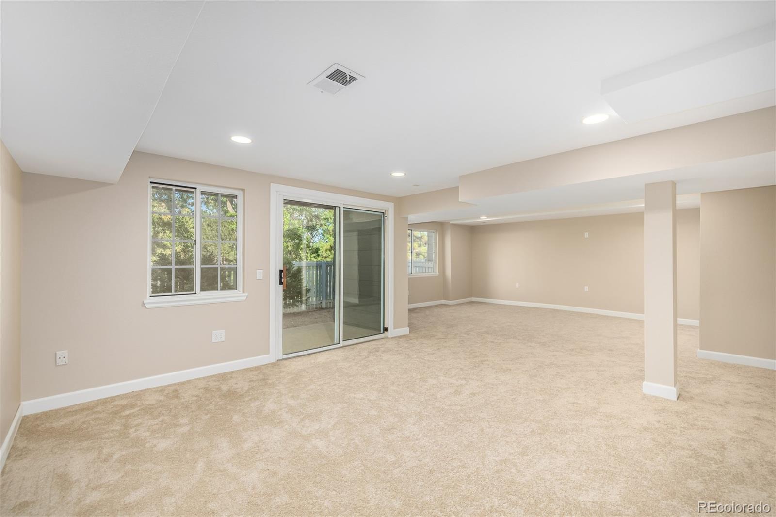 10401 West Red Mountain Road Littleton, CO 80127 - Photo 28 of 40 a view of an empty room with a window