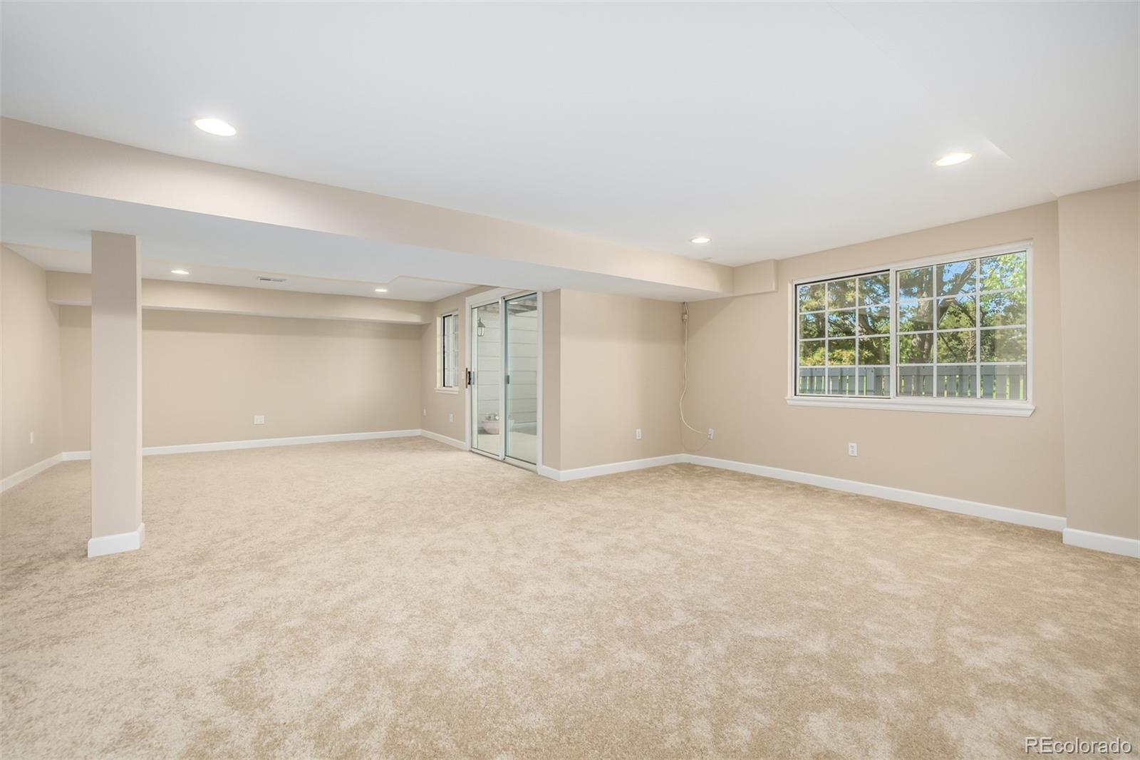 10401 West Red Mountain Road Littleton, CO 80127 - Photo 30 of 40 an empty room with windows and closet