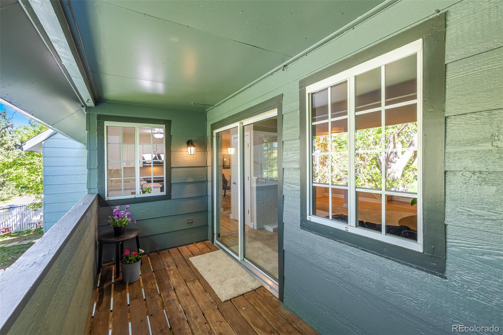 10401 West Red Mountain Road Littleton, CO 80127 - Photo 35 of 40 a balcony with wooden floor