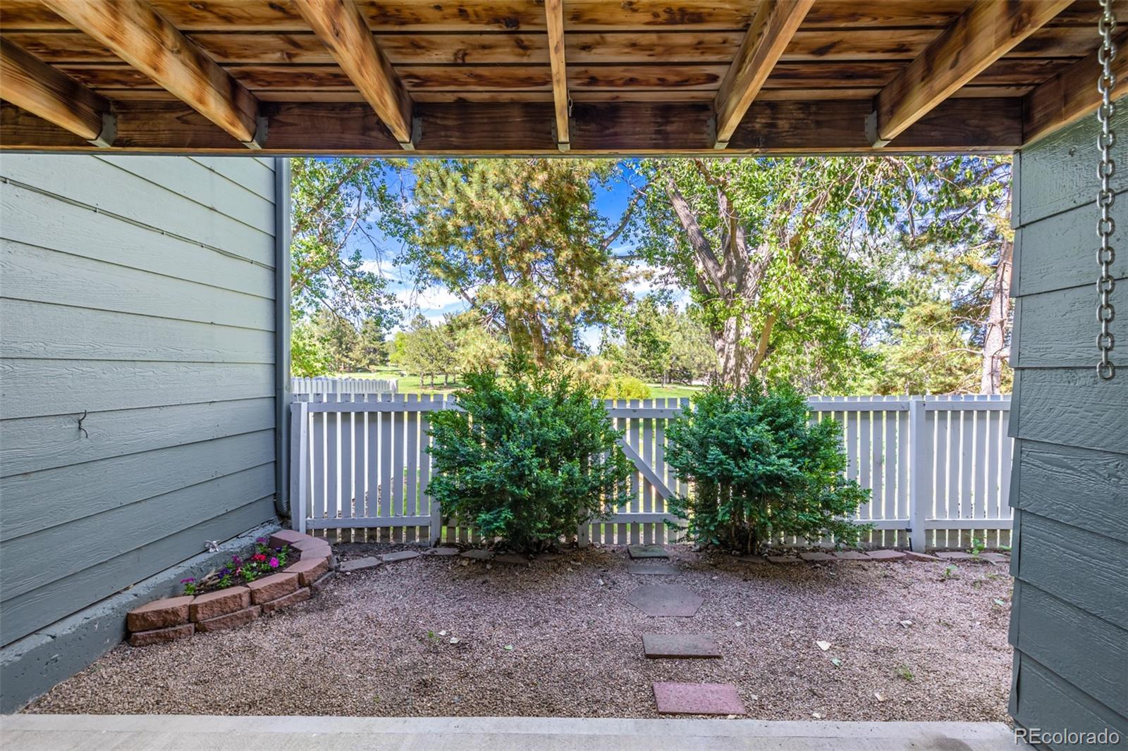 10401 West Red Mountain Road Littleton, CO 80127 - Photo 38 of 40 a view of a backyard with plants