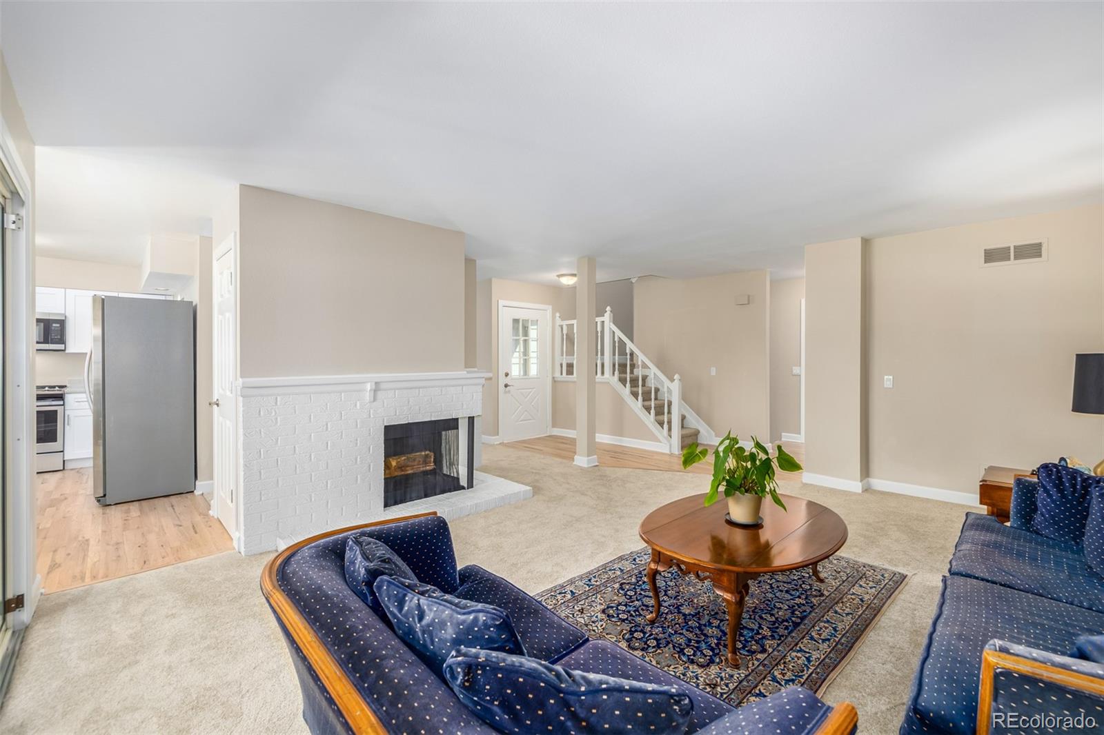 10401 West Red Mountain Road Littleton, CO 80127 - Photo 8 of 40 a living room with furniture and a fireplace