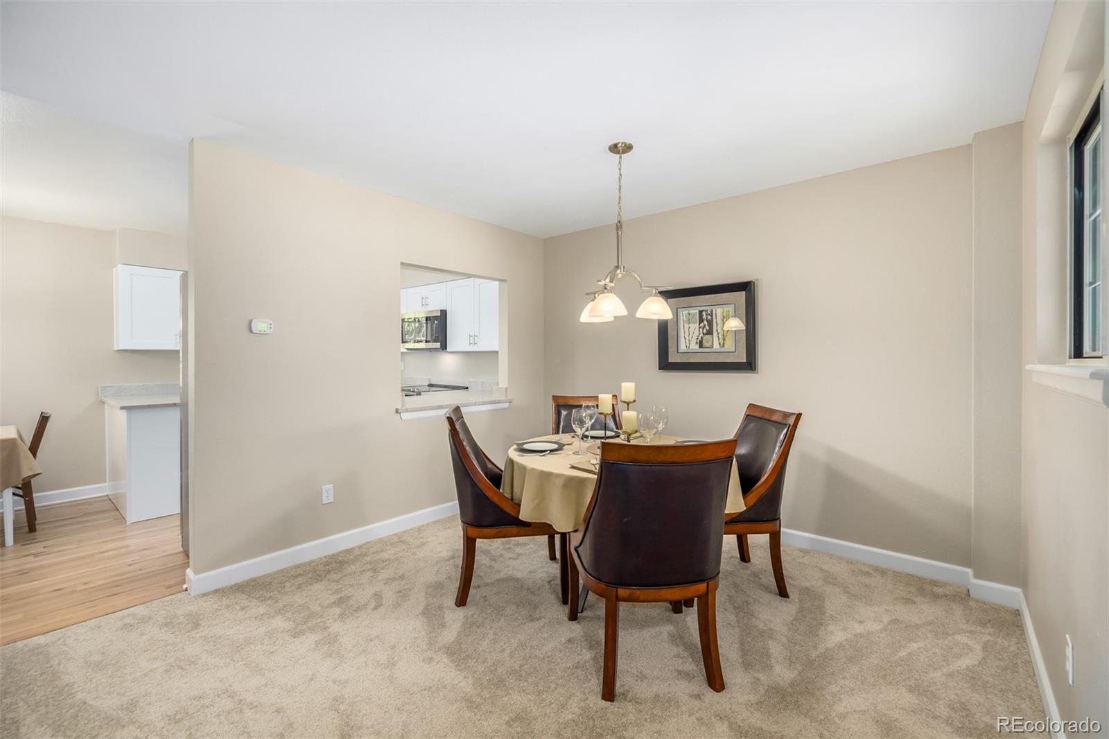 10401 West Red Mountain Road Littleton, CO 80127 - Photo 9 of 40 a view of a dining room with furniture