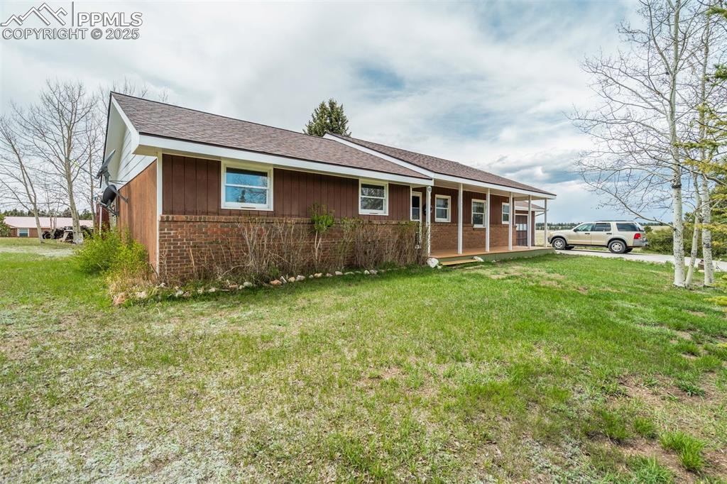 65 Yeoman Lane Divide, CO 80814 - Photo 4 of 43 a front view of house with yard and green space