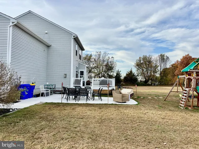 a white toilet sitting next to a bathroom sink and a toilet