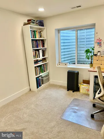 a bathroom with a toilet and a shower curtain