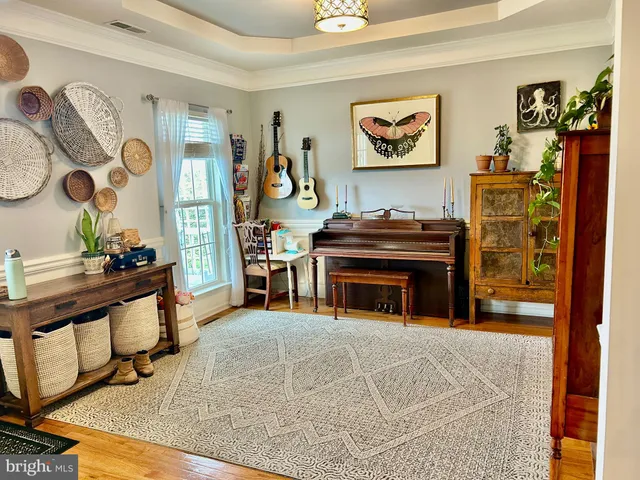 a view of a dining room with furniture large window and chandelier