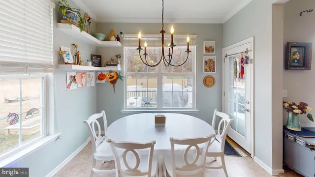 a living room with furniture a flat screen tv and a stove